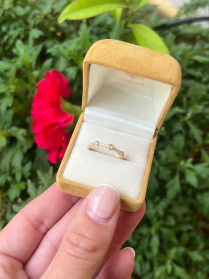 Media alianza BOMBON en oro amarillo con brillantes