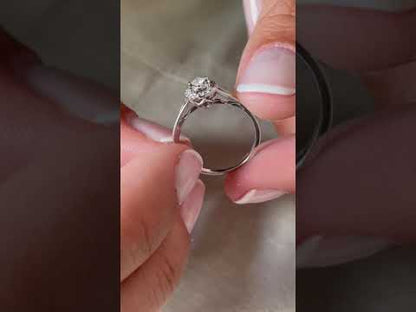 Anillo QUIMPER solitario rodeado de brillante en oro blanco de 18 ktes.