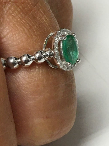 Anillo SAHNAZ de oro blanco con brillantes y esmeralda, rubí o zafiro