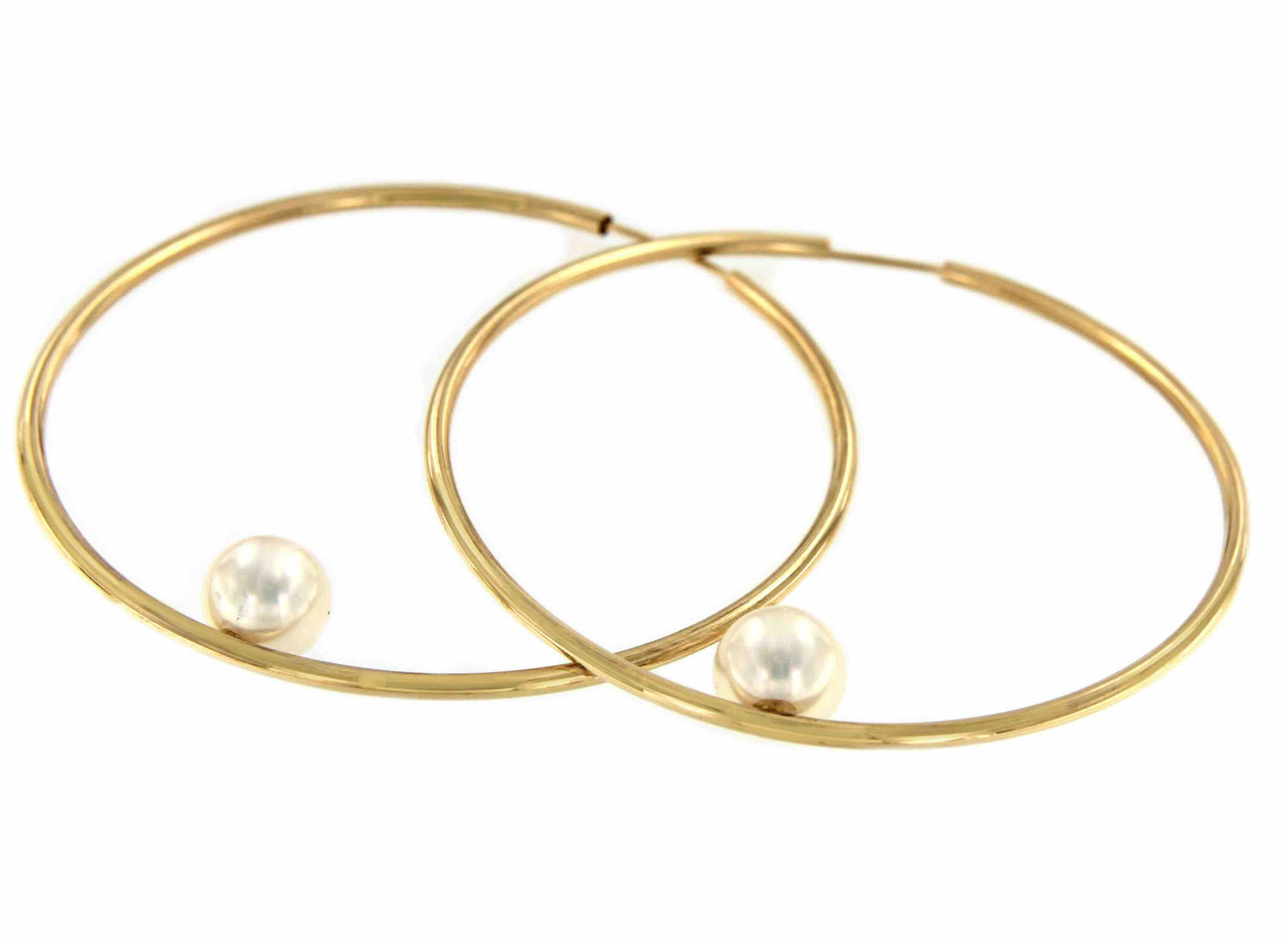 Argollas oro amarillo SOEL huecas en 18 kilates con perla